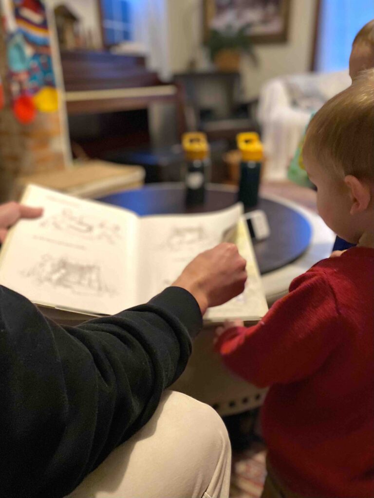 dad showing how to make reading to toddlers exciting
